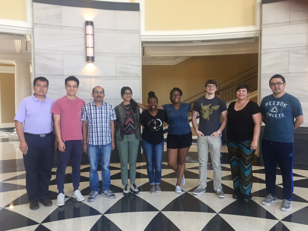 a group of students and Dr Pan in the lobby of Shelby Hall